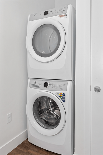 Front load washing machine in laundry room